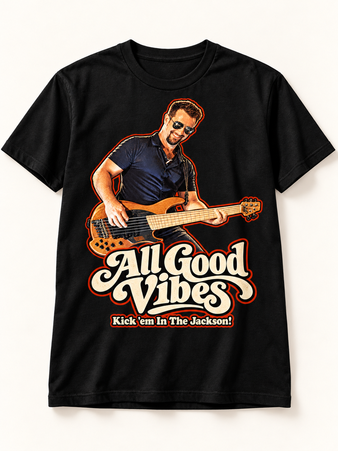 Black Dustin Edition shirt with bass-playing artwork and Kick 'em In The Jackson! lettering